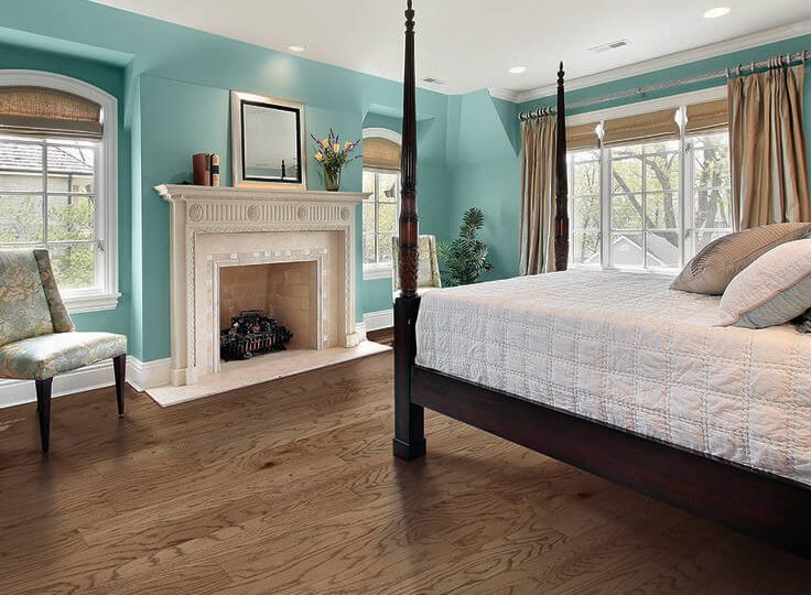 a bed on a hardwood floor