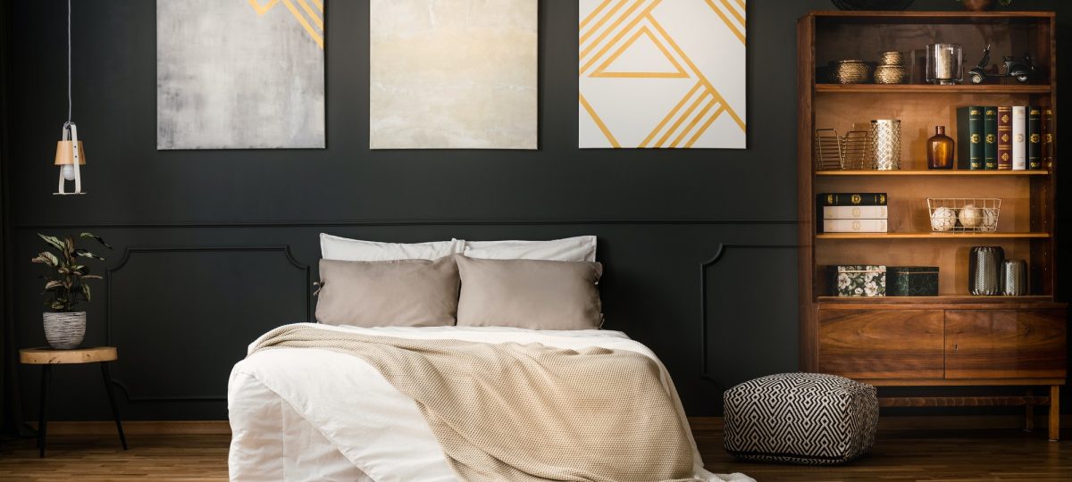 Antique bookcase in dark bedroom