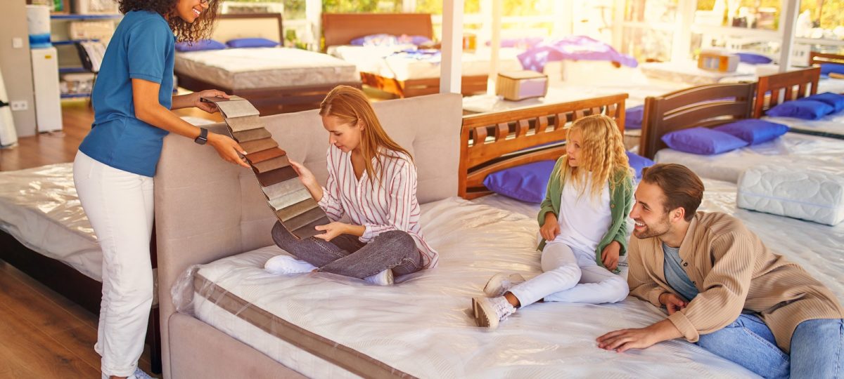 A family shopping for a new bed and asking what is a split box spring.