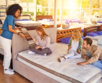 A family shopping for a new bed and asking what is a split box spring.