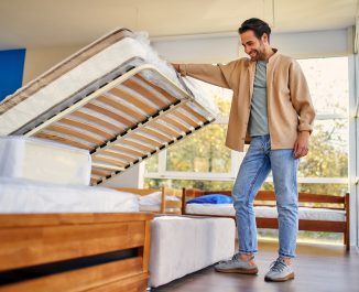 Split Queen Box Spring. Man checking out a bed.