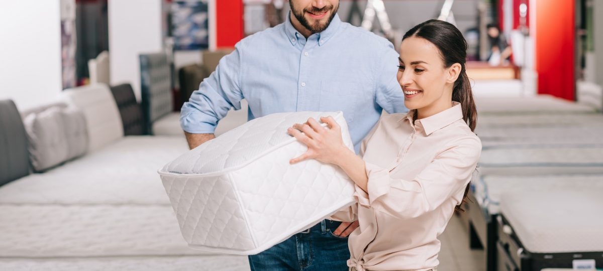 What Is The Normal Thickness Of A Mattress & Boxspring. Couple checking the thickness.