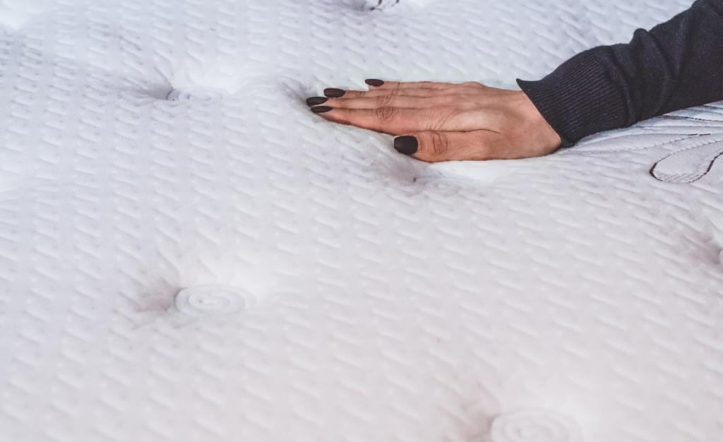 Girl touches the mattress. Organic Latex Mattresses.