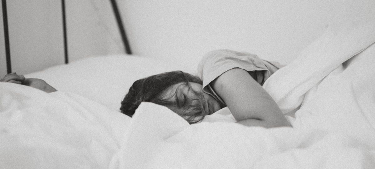 A woman testing a mattress