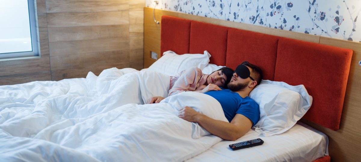 Couple getting a healthy night of sleep.