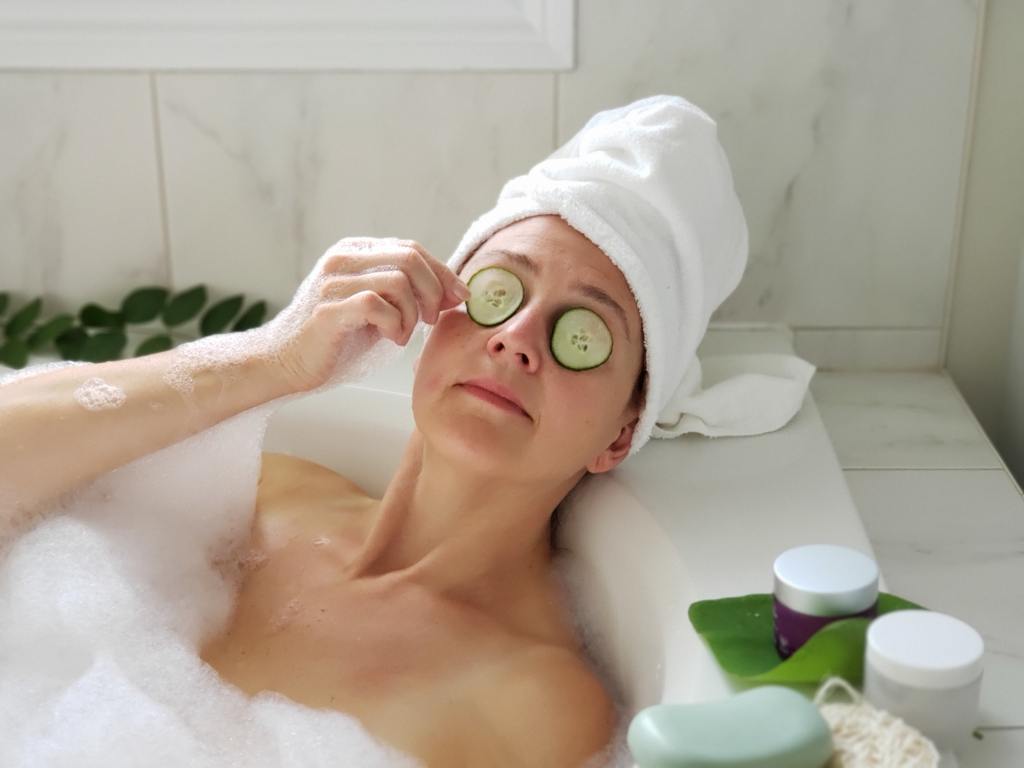 Woman in bathtub having relaxing time. How To Create The Ultimate Sleep-Friendly Home For Buyers.