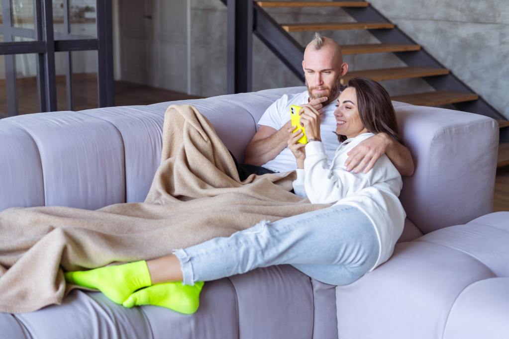 A young couple about to have a cozy date night at home.