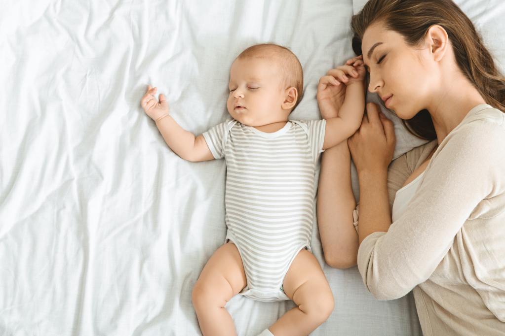 Mother co sleeping with infant.